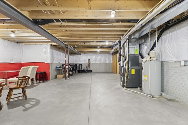 basement with electric water heater and heating unit