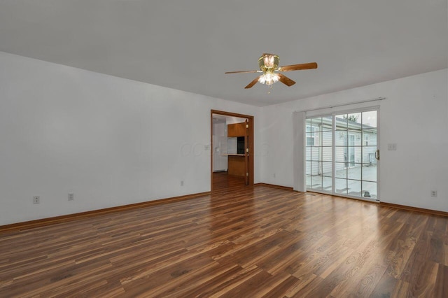 unfurnished room featuring ceiling fan and dark hardwood / wood-style floors