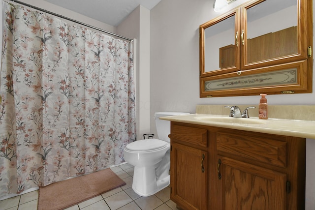 bathroom featuring a shower with curtain, toilet, vanity, and tile patterned flooring