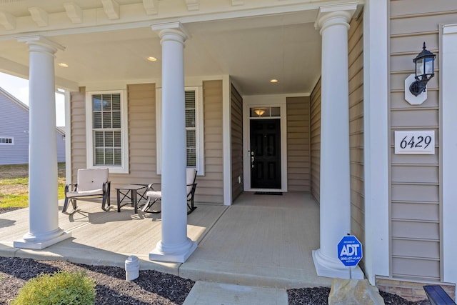 doorway to property featuring a porch