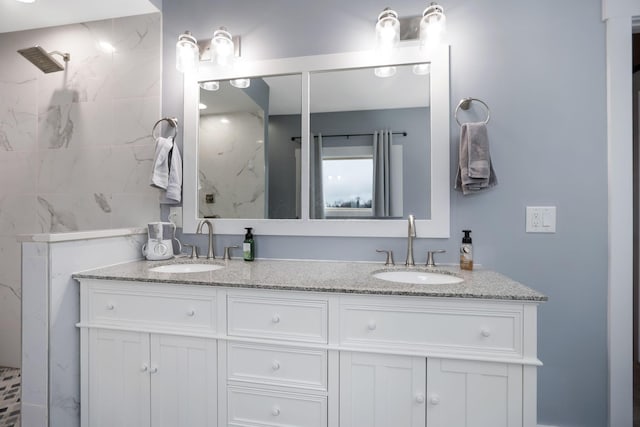 bathroom with vanity and a shower