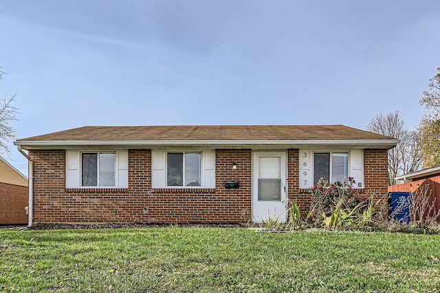 ranch-style house with a front lawn