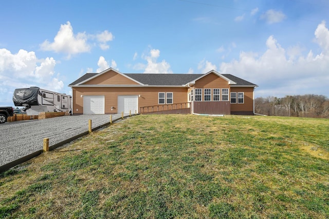 ranch-style house featuring a front lawn