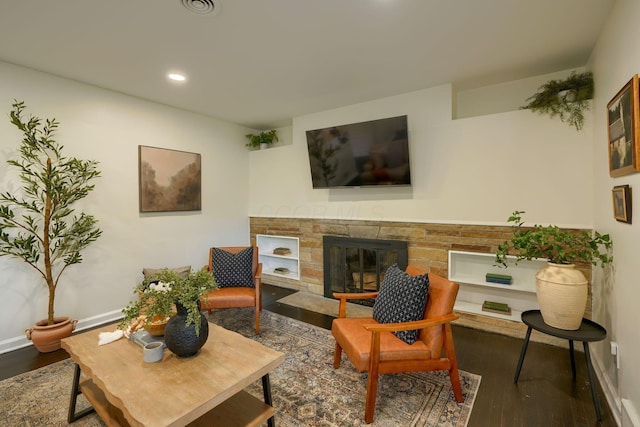 living room featuring a fireplace and hardwood / wood-style floors