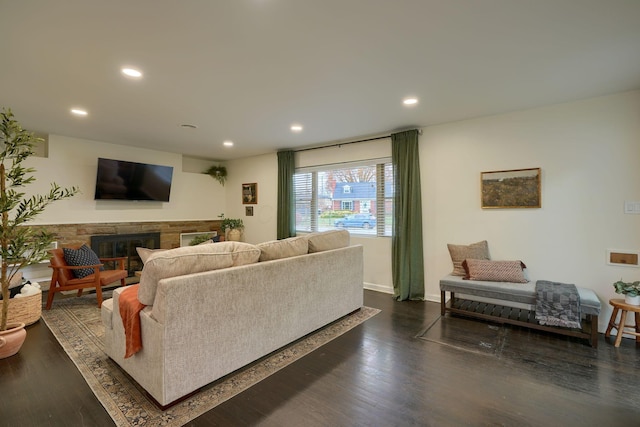 living room with dark hardwood / wood-style flooring