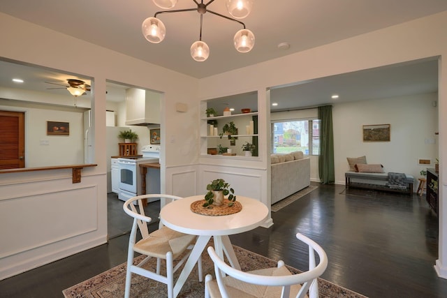 dining room featuring ceiling fan and dark hardwood / wood-style floors