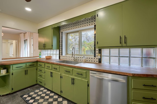 kitchen featuring decorative backsplash, wooden counters, sink, dishwasher, and green cabinets