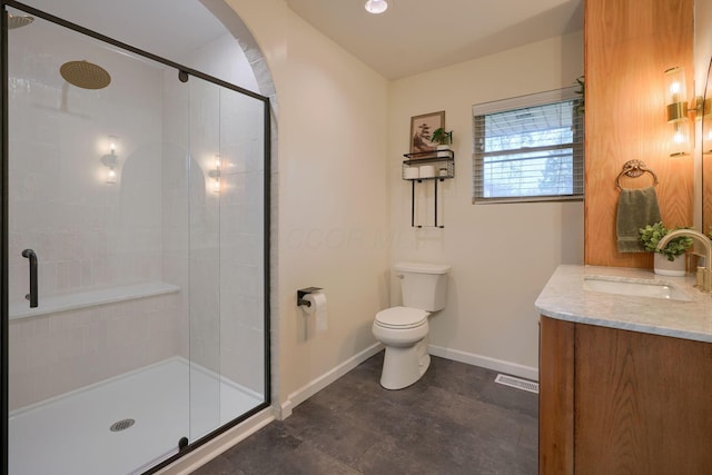 bathroom featuring walk in shower, vanity, and toilet