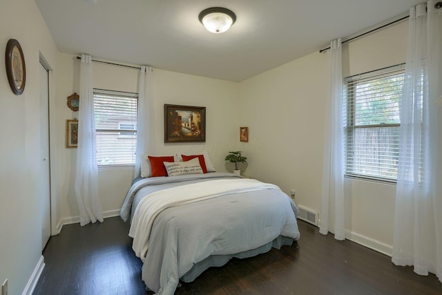 bedroom featuring dark hardwood / wood-style floors