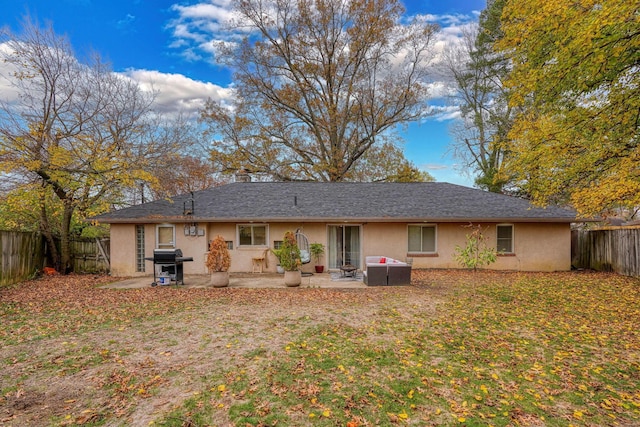 back of house with a patio