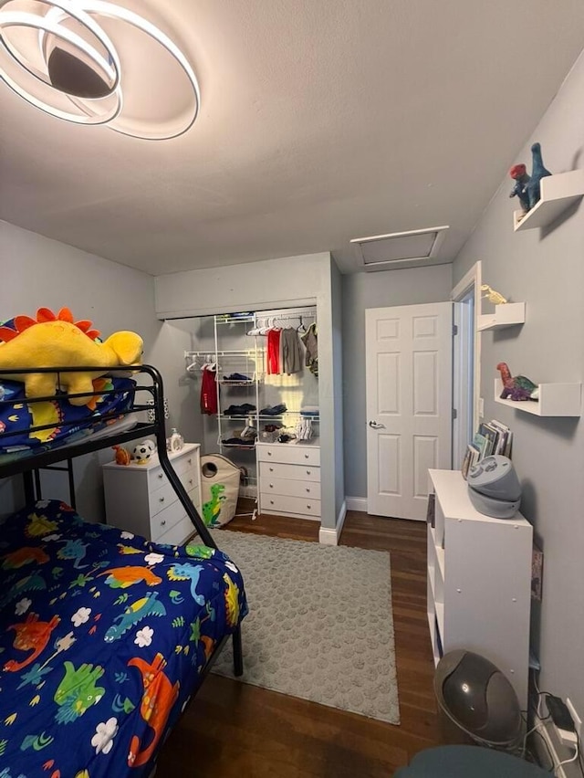 bedroom featuring a closet and dark wood-type flooring