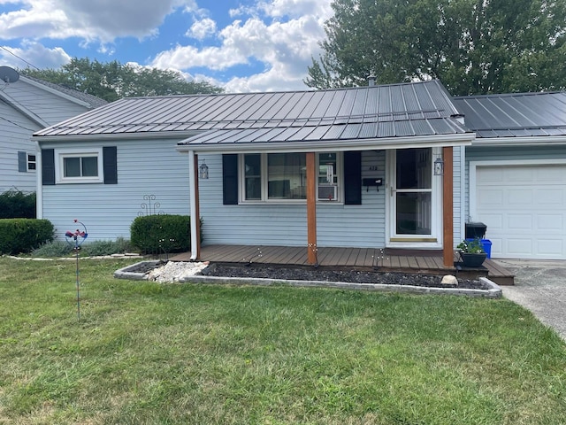 single story home with a garage and a front lawn