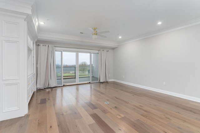 empty room with crown molding, light hardwood / wood-style flooring, and ceiling fan