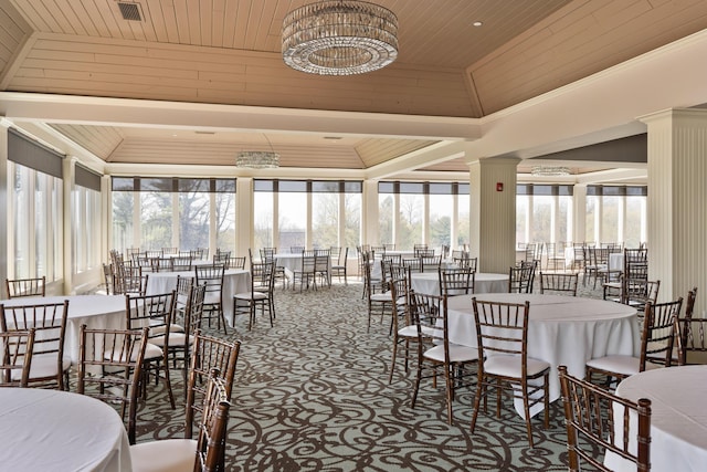 carpeted dining area featuring a raised ceiling, wooden ceiling, crown molding, and vaulted ceiling