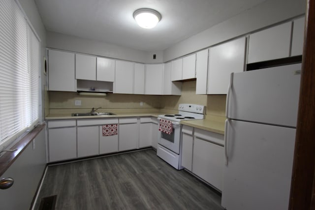 kitchen with white cabinetry, sink, and white appliances