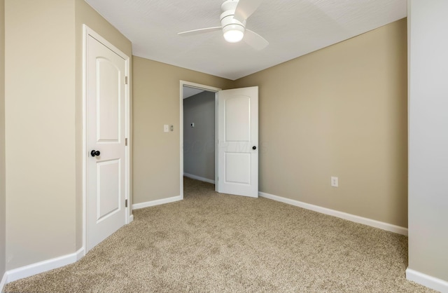 unfurnished bedroom featuring ceiling fan and light colored carpet