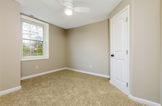 carpeted empty room with ceiling fan