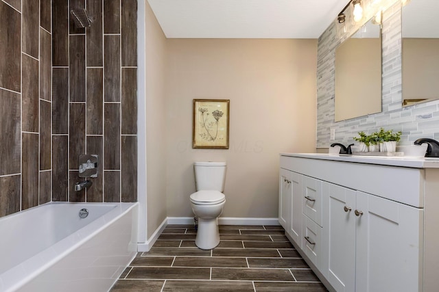 full bathroom with vanity, toilet, and tiled shower / bath combo