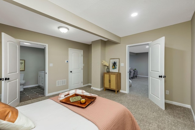 bedroom featuring carpet flooring and ensuite bathroom