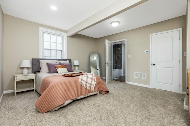 carpeted bedroom with beamed ceiling