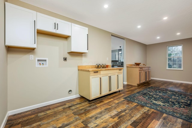 kitchen featuring butcher block countertops, decorative backsplash, white cabinets, and dark wood-type flooring