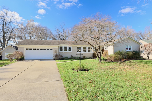 ranch-style home with a garage and a front yard