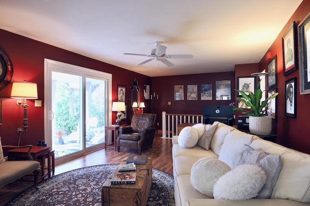 living room featuring hardwood / wood-style floors and ceiling fan