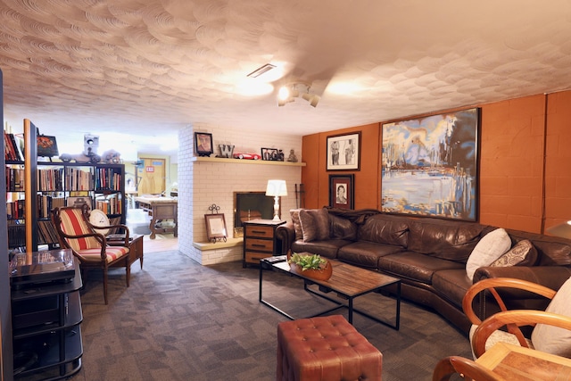 carpeted living room with a textured ceiling