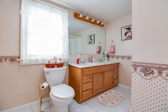 bathroom with tile patterned floors, vanity, and toilet