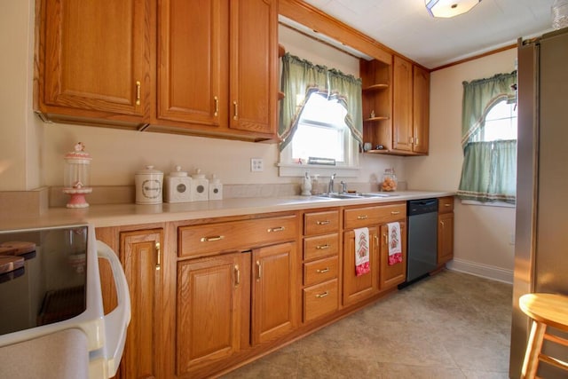 kitchen with stainless steel dishwasher, plenty of natural light, white range oven, and sink