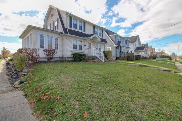 view of front of home with a front lawn