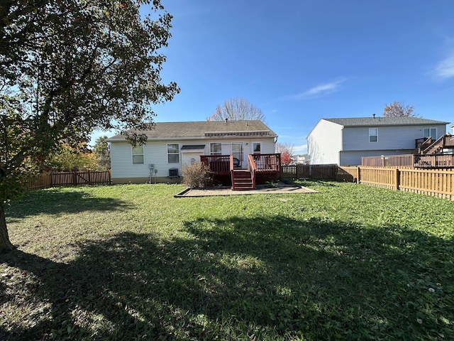 rear view of property with central AC, a yard, and a deck