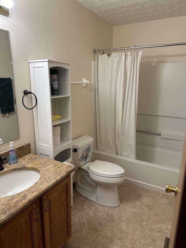 full bathroom with shower / tub combo, vanity, a textured ceiling, tile patterned flooring, and toilet