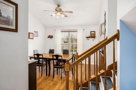 dining area with ceiling fan and hardwood / wood-style floors