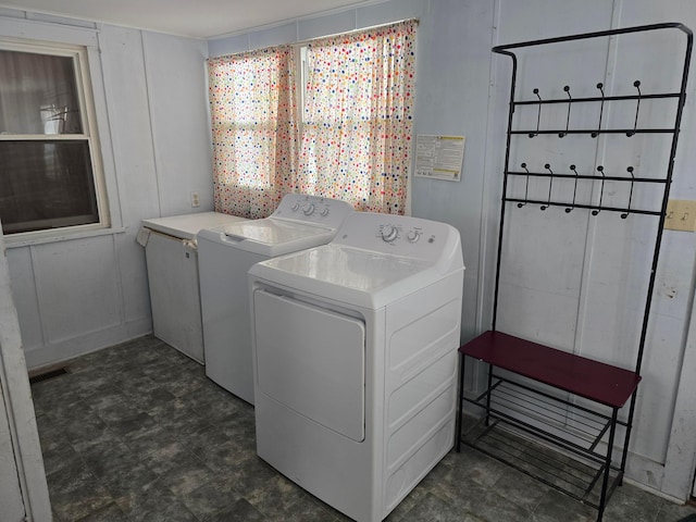 laundry room with separate washer and dryer