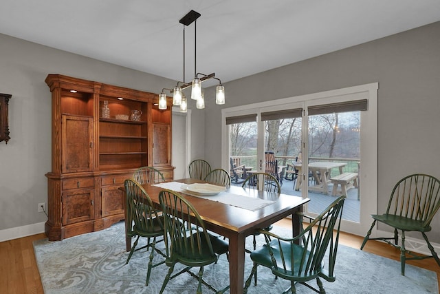 dining space featuring light wood-type flooring