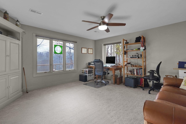 office space with ceiling fan and light colored carpet