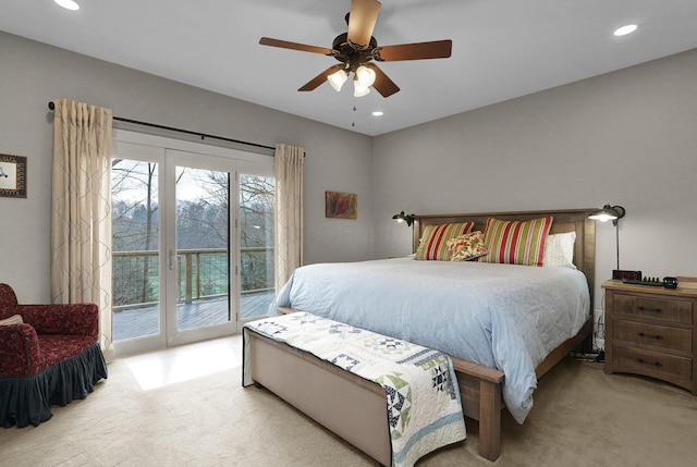 bedroom featuring access to outside, light colored carpet, and ceiling fan