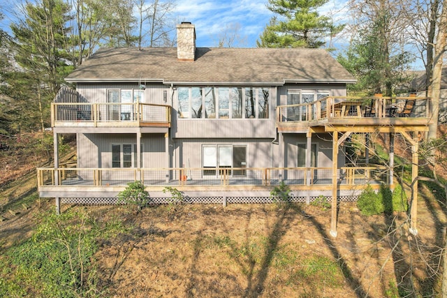 rear view of house with a wooden deck