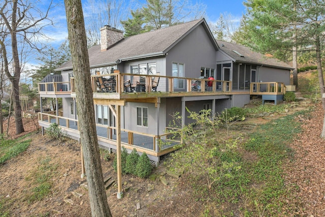 rear view of house with a deck