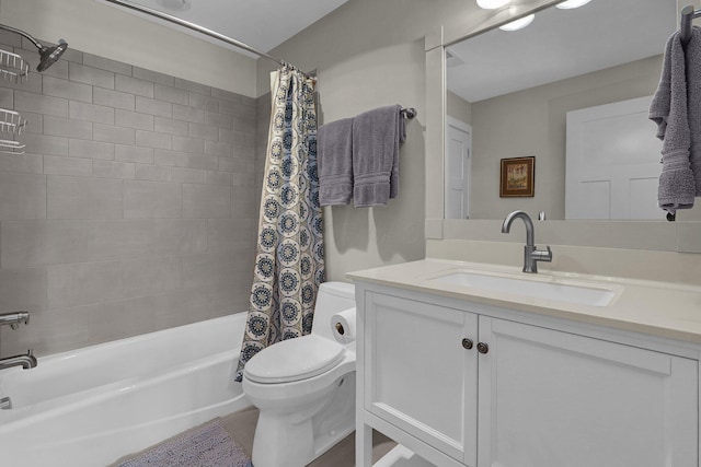 full bathroom with vanity, toilet, and shower / bath combo with shower curtain