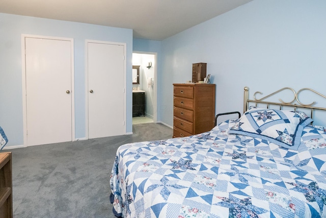 carpeted bedroom with ensuite bath