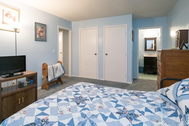 carpeted bedroom featuring connected bathroom