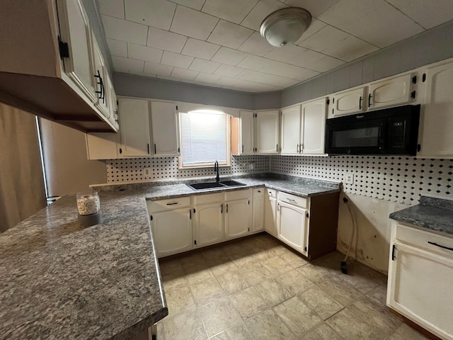 kitchen featuring backsplash and sink