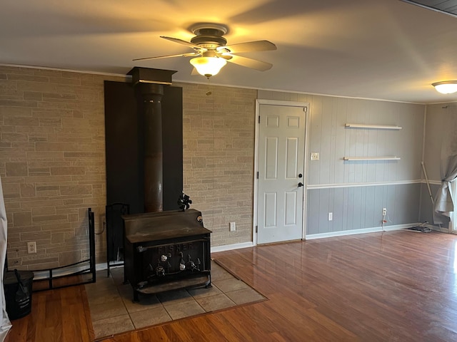 living room featuring ceiling fan and hardwood / wood-style floors