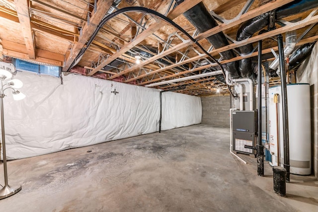 basement featuring heating unit and water heater