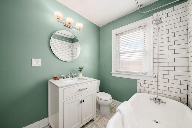 bathroom featuring a bath, vanity, toilet, and tile patterned floors