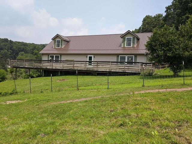 exterior space featuring a deck and a front yard