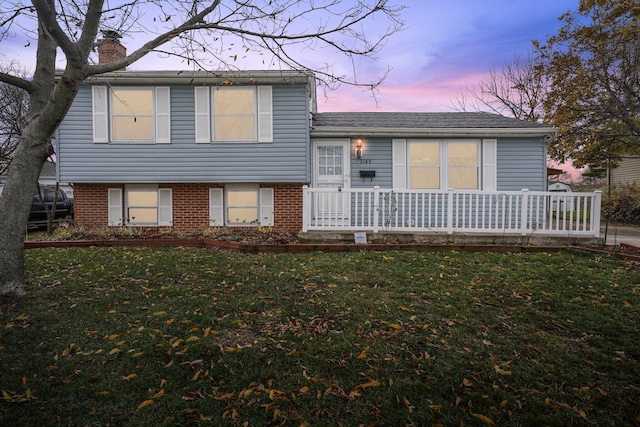 view of front of house with a lawn