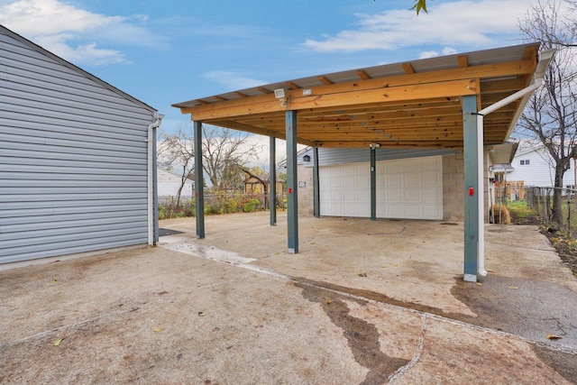 view of patio with a garage and a carport